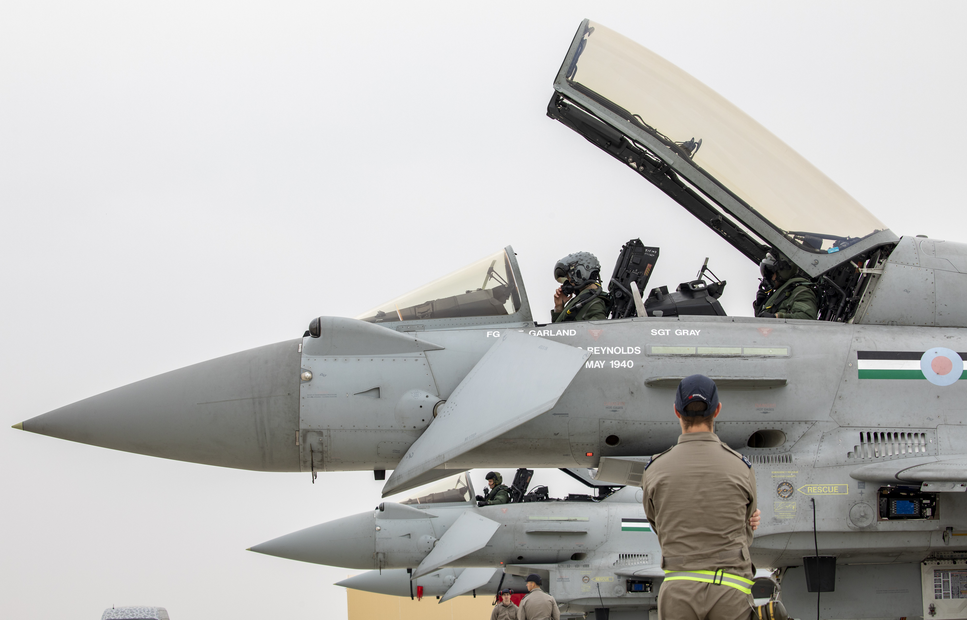 Image shows RAF aviators in the open cockpit of a Typhoon.